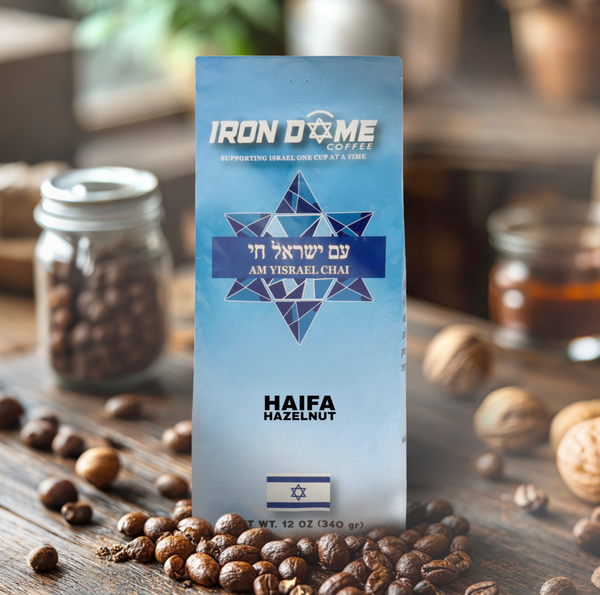 Coffee bag labeled 'Iron Dome Coffee' with hazelnuts and coffee beans around.