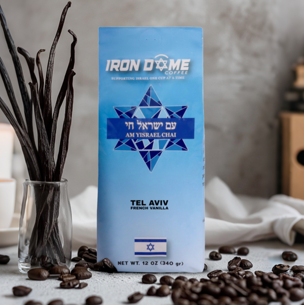 Blue coffee bag with Hebrew text, vanilla pods, and coffee beans.