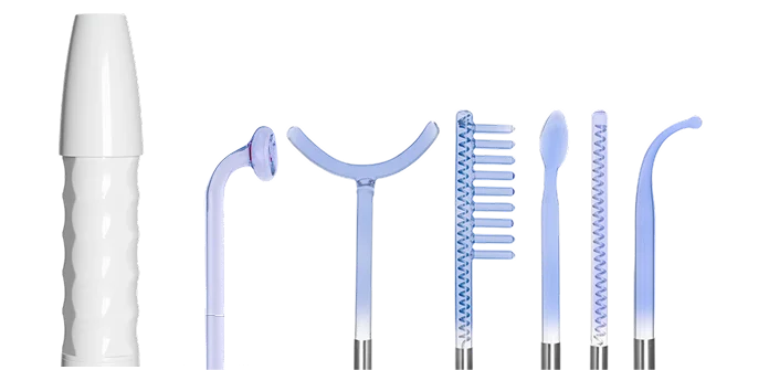 A white high-frequency therapy wand with its six interchangeable blue glass electrode attachments against a white background.