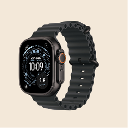 A dark grey smartwatch with a black, wavy band is shown at an angle on a tan background.