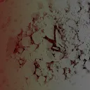 A very blurry, abstract image of a pile of light-colored, granular material with a reddish-brown tint.