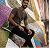 Person sitting on colorful geometric mural background.
