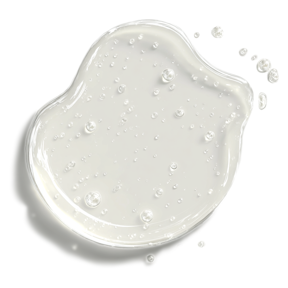 Irregular splash of clear liquid with bubbles on a white background.