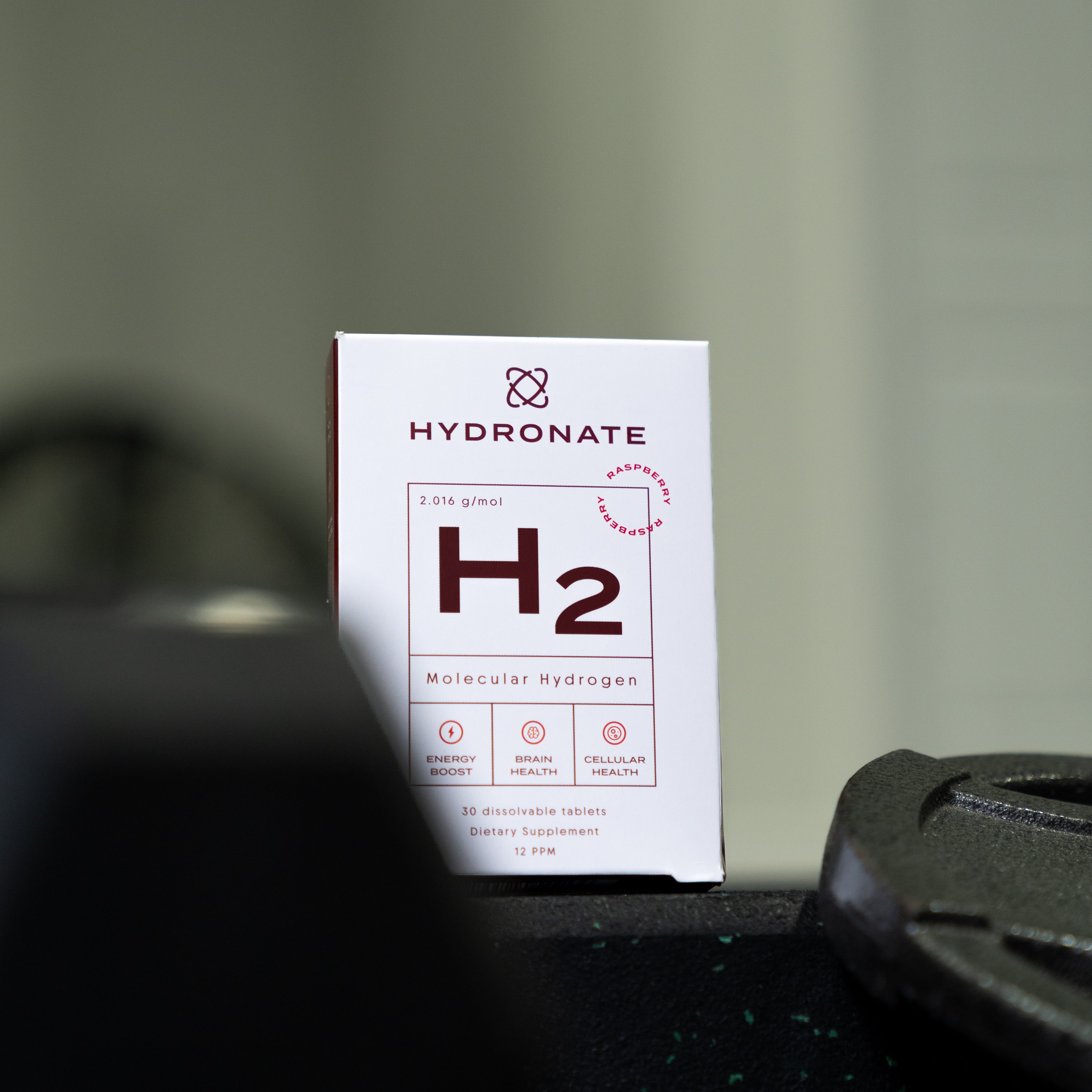 Box of Hydronate H2 tablets on a gym bench.