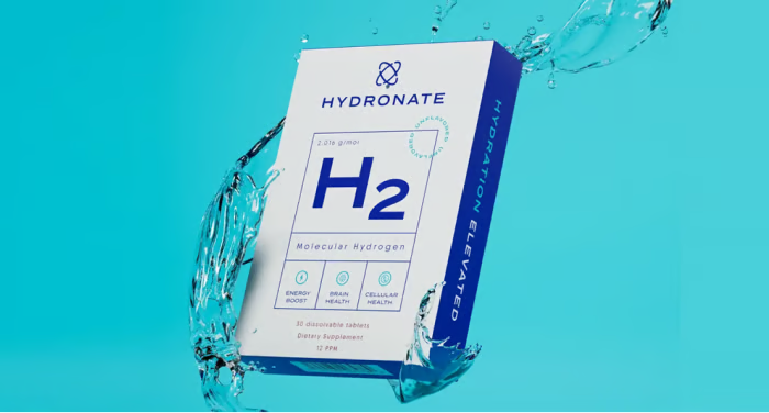 A box of Hydronate H2 Molecular Hydrogen supplement with water splashing around it against a blue background.