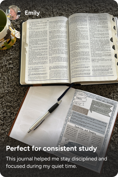 An open Bible and journal with a pen lie on a carpet next to a mug.