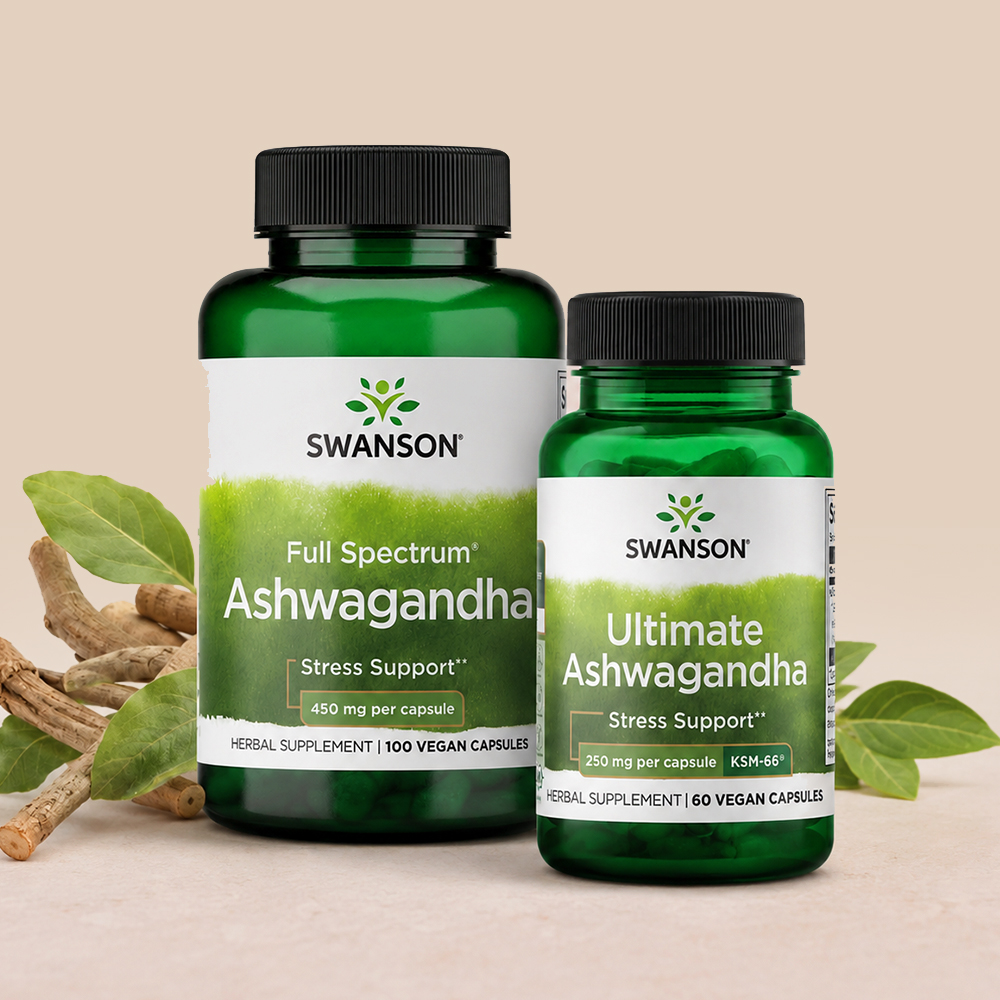 Two Swanson ashwagandha supplement bottles, Full Spectrum and Ultimate KSM-66, displayed with ashwagandha roots and green leaves.