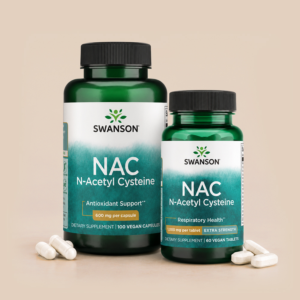 Two Swanson NAC N-Acetyl Cysteine supplement bottles in different strengths displayed on a beige background with capsules and tablets.