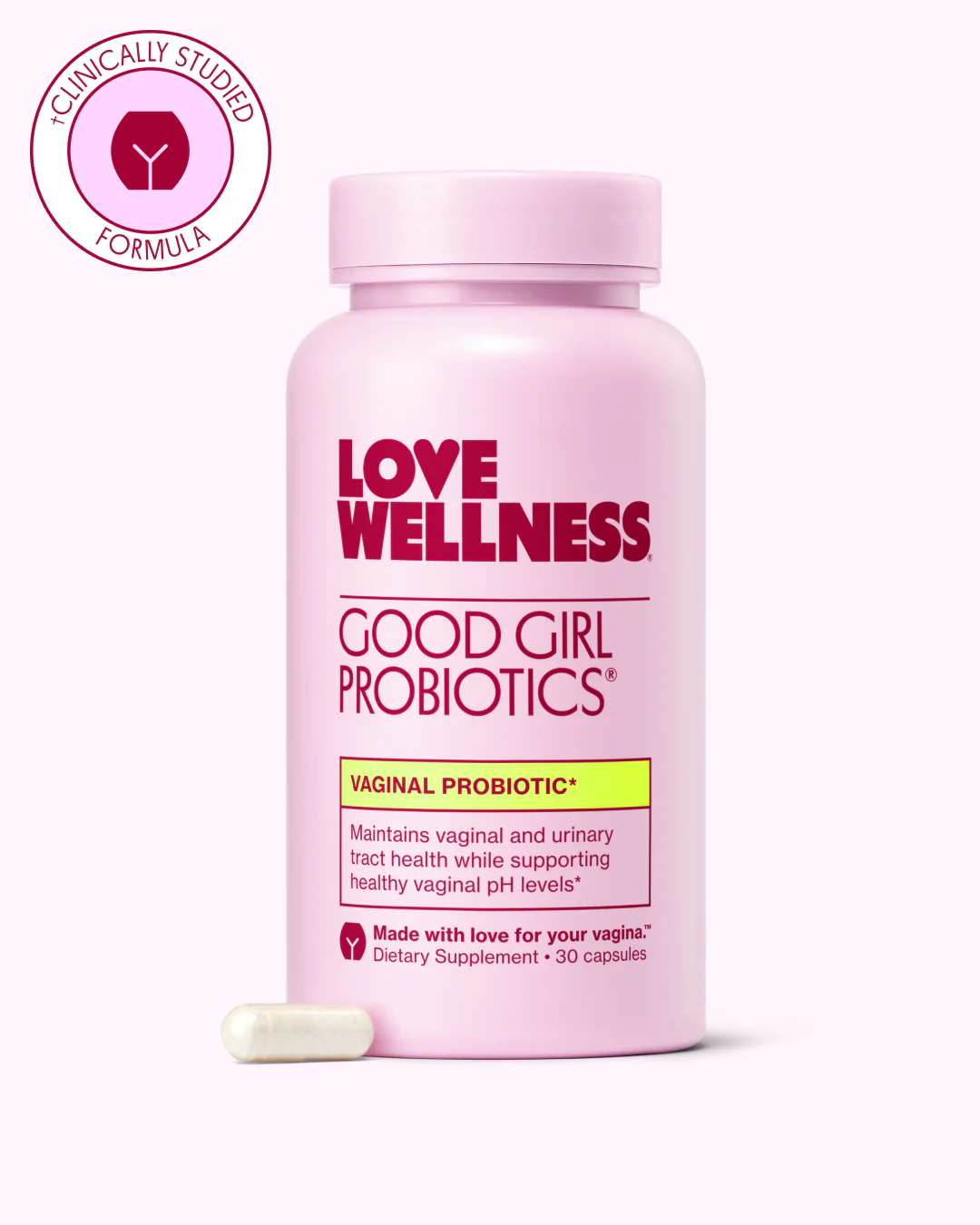 Pink bottle of Love Wellness Good Girl Probiotics with a capsule beside it.