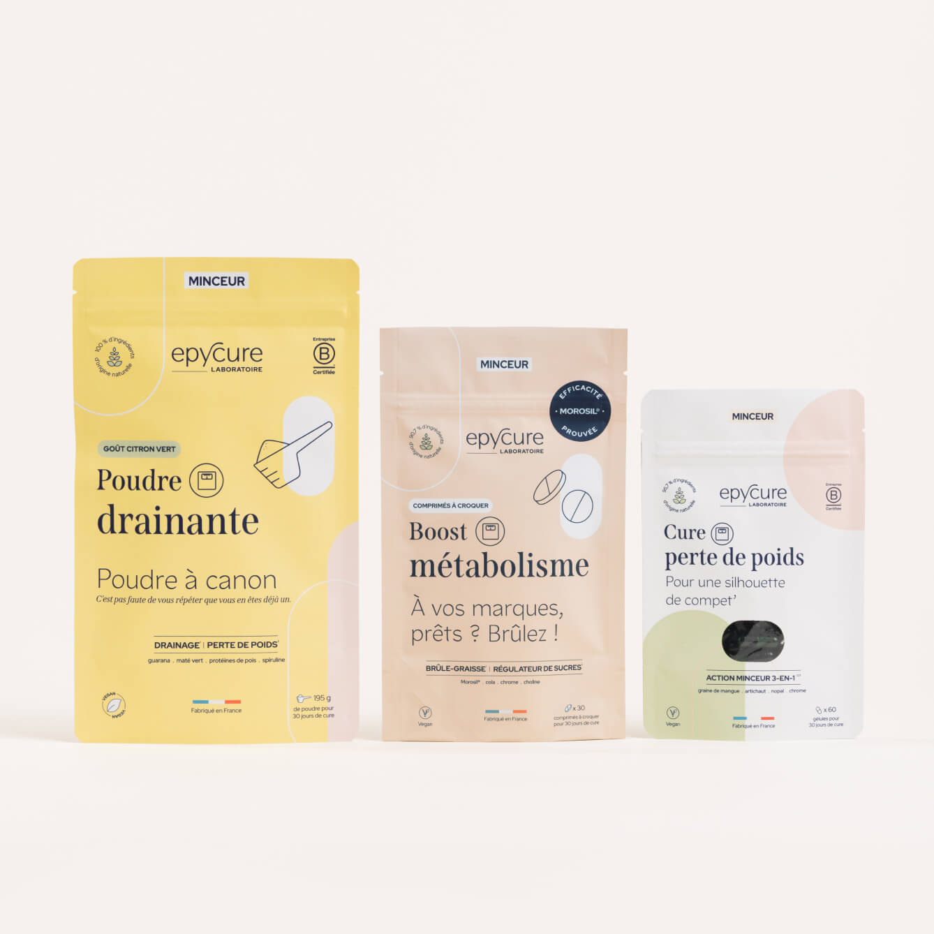 Three labeled pouches of dietary supplements on a plain background.