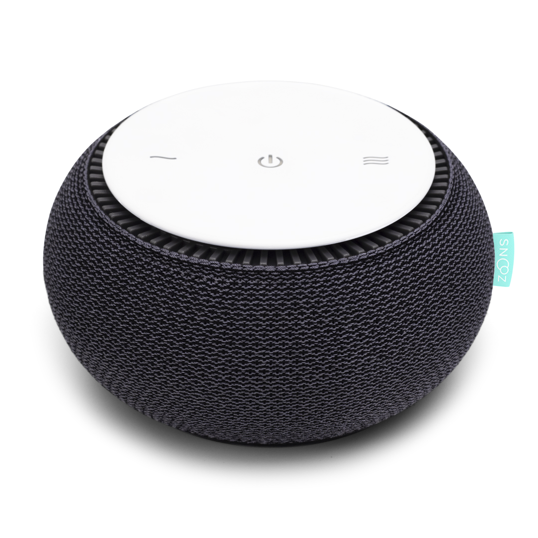 A round SNOOZ white noise machine with a charcoal fabric cover and white top against a white background.