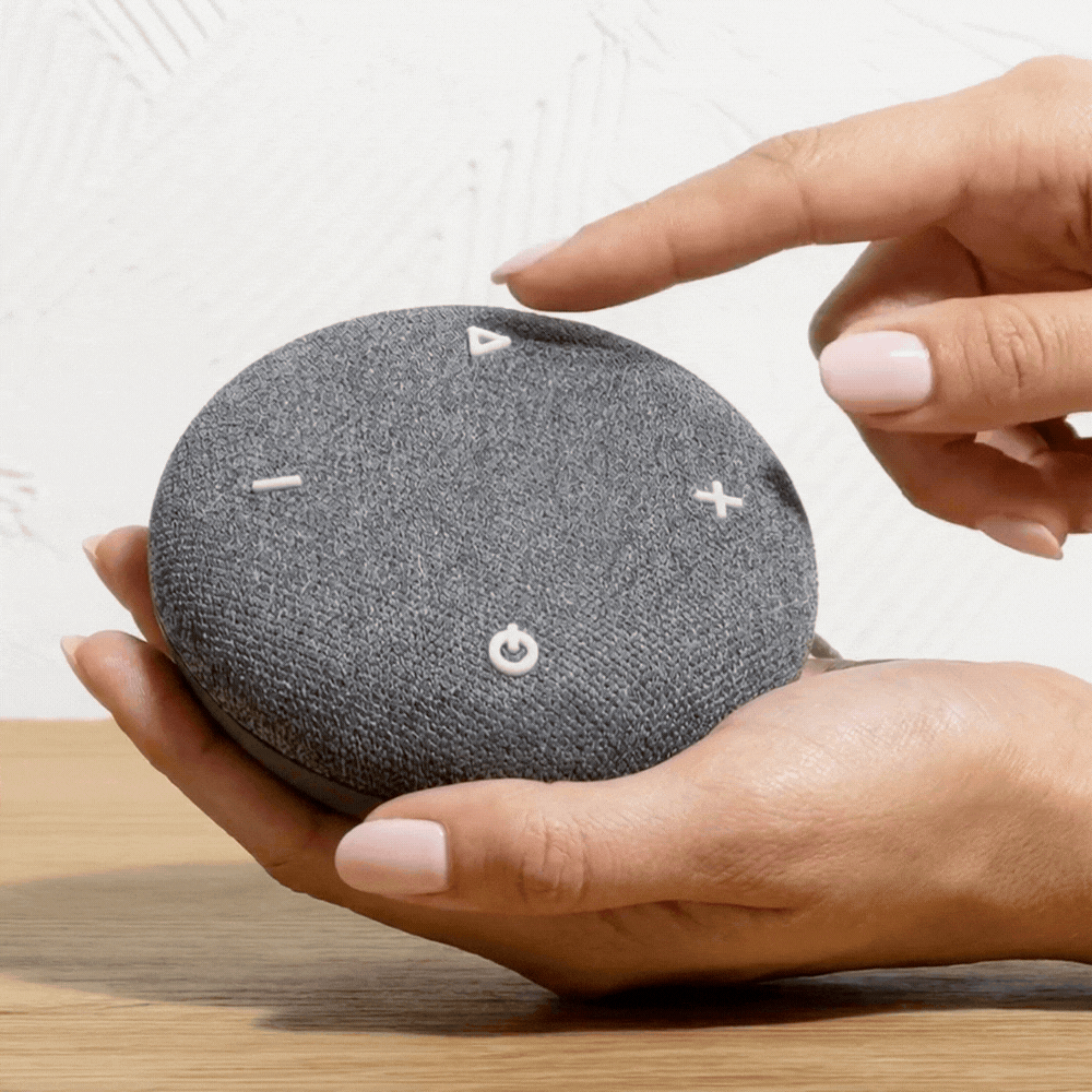 Woman's hand taps the Play button to demonstrate switching between sounds.