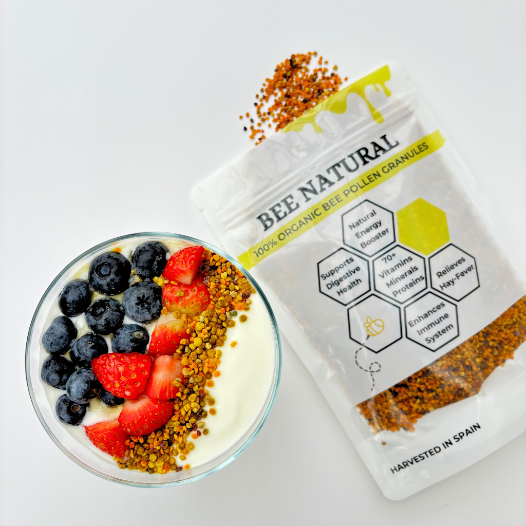 Yogurt with blueberries, strawberries, and bee pollen next to a bee pollen package.