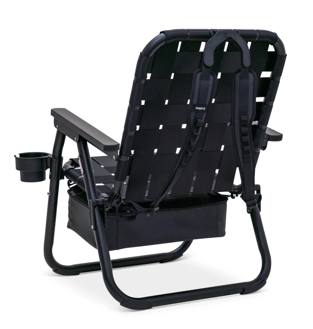 Black folding chair with patterned straps, wooden armrests, and a cup holder.