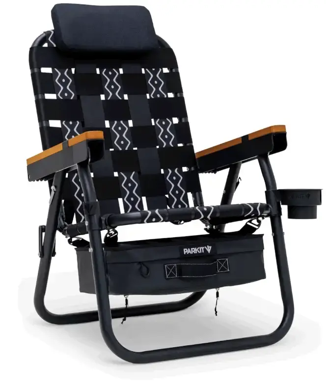 Folding black and gray patterned chair with armrests and attached storage pouch.