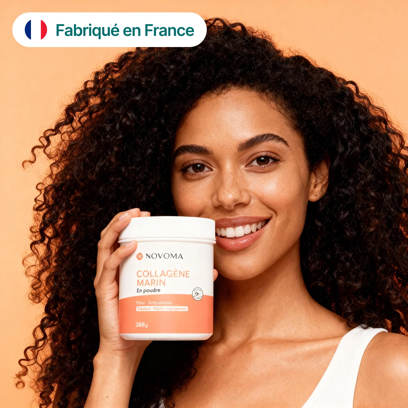 Person smiling, holding a container labeled 'Novoma Collagène Marin.'
