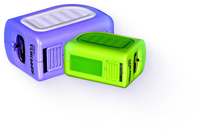 Two colorful universal travel adapters in purple and green.