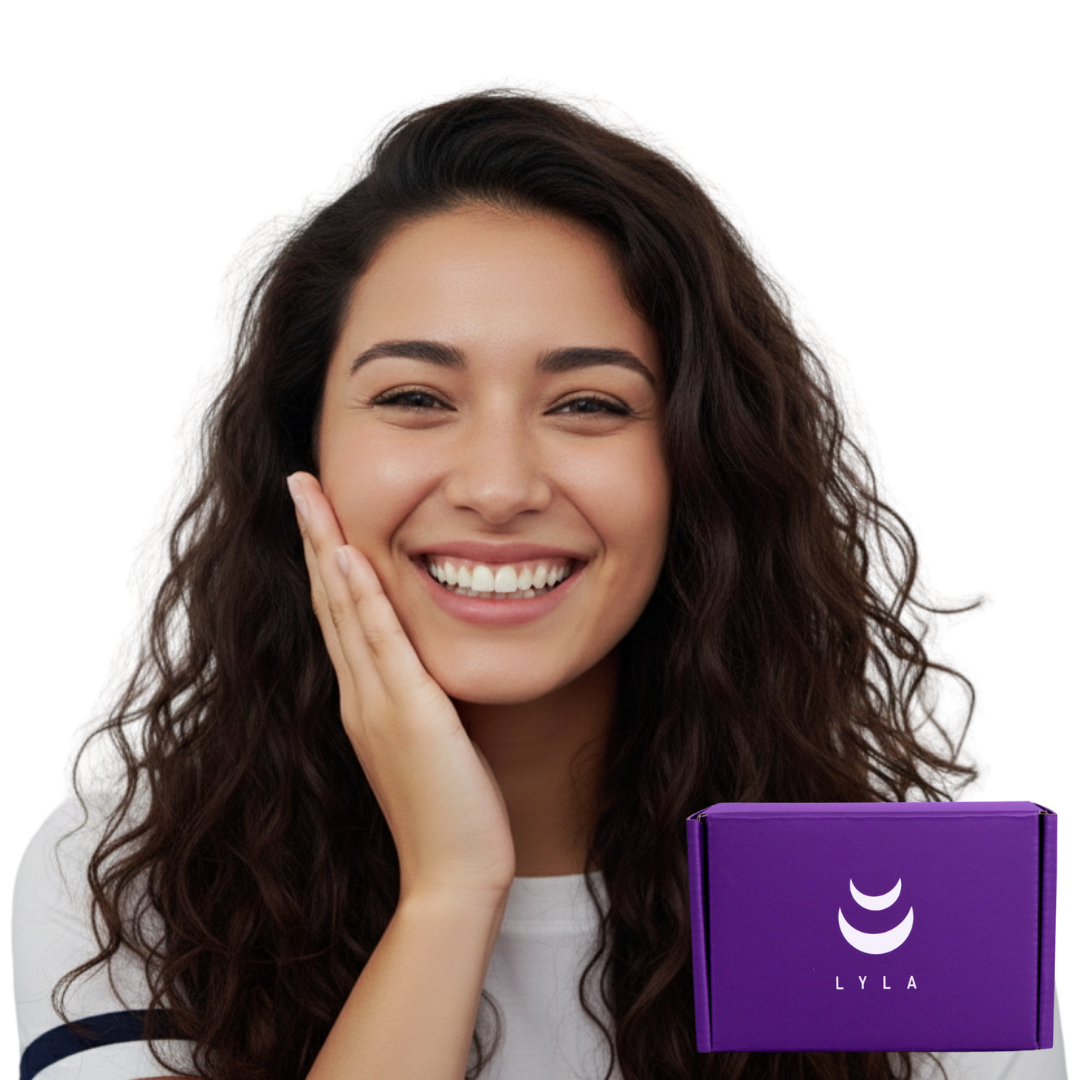 A smiling woman with long curly hair holds her cheek while a purple box labeled Lyla sits nearby.