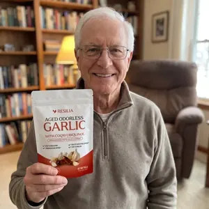 Resilia customer holding the Aged Garlic pouch