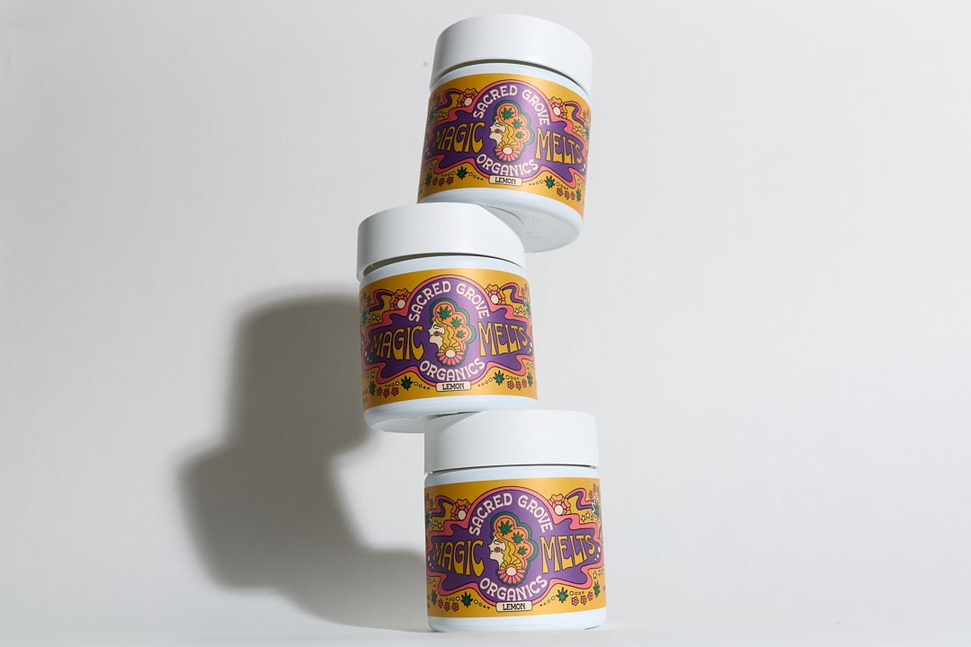 Three stacked jars with colorful labels on a white background.