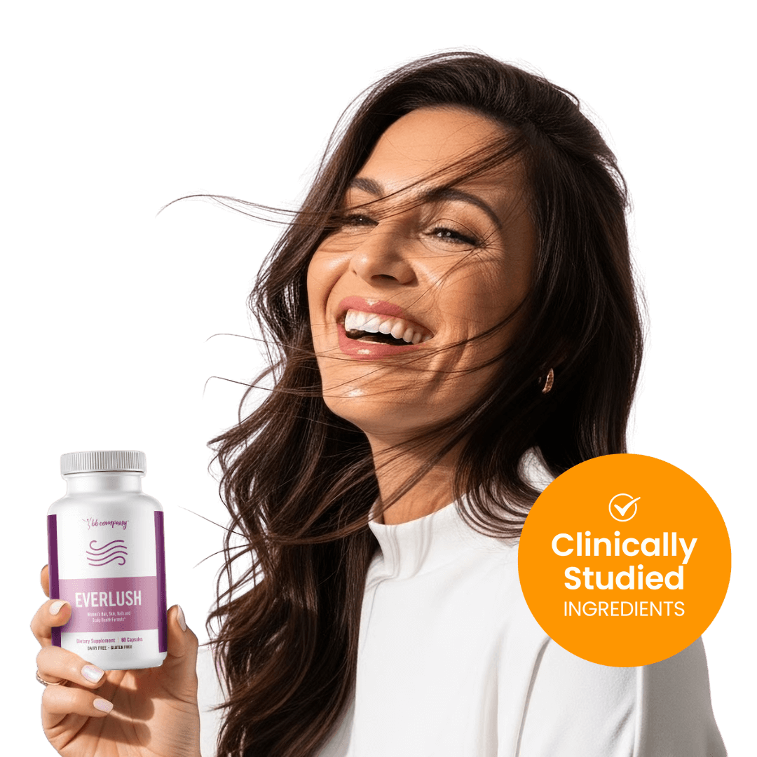 Woman smiling, holding a bottle labeled 'Everlush' against a pink background.