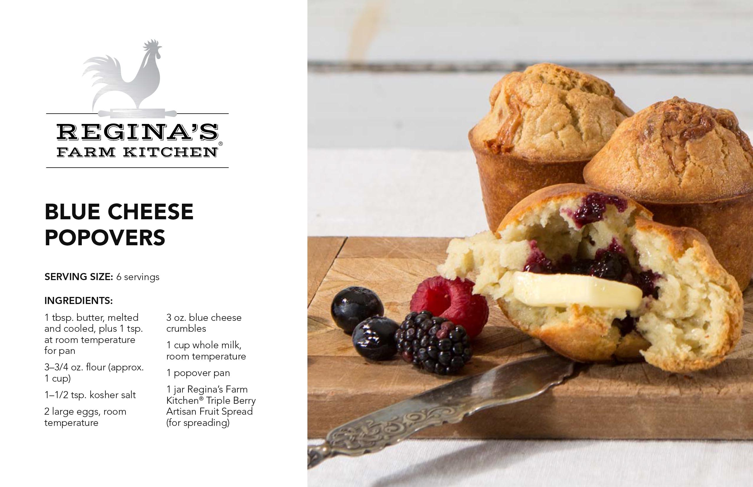 Blue cheese popovers with berry spread and butter, accompanied by fresh berries on a wooden board.