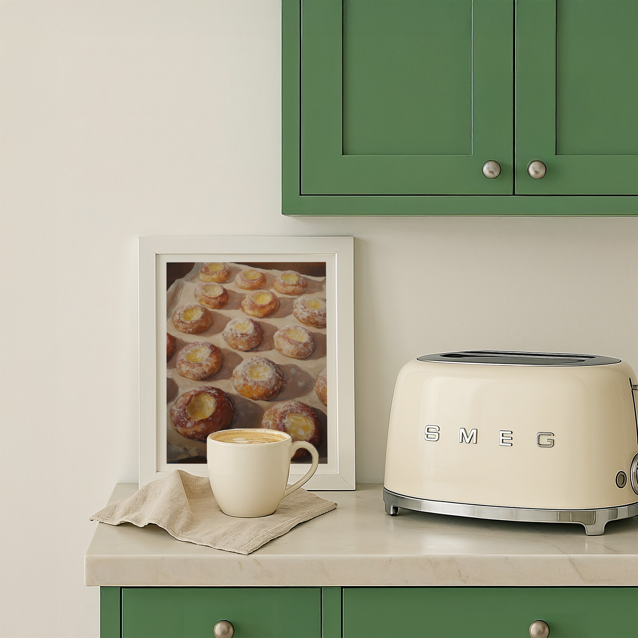 Kitchen counter with a toaster, framed photo of pastries, and a cup of coffee.