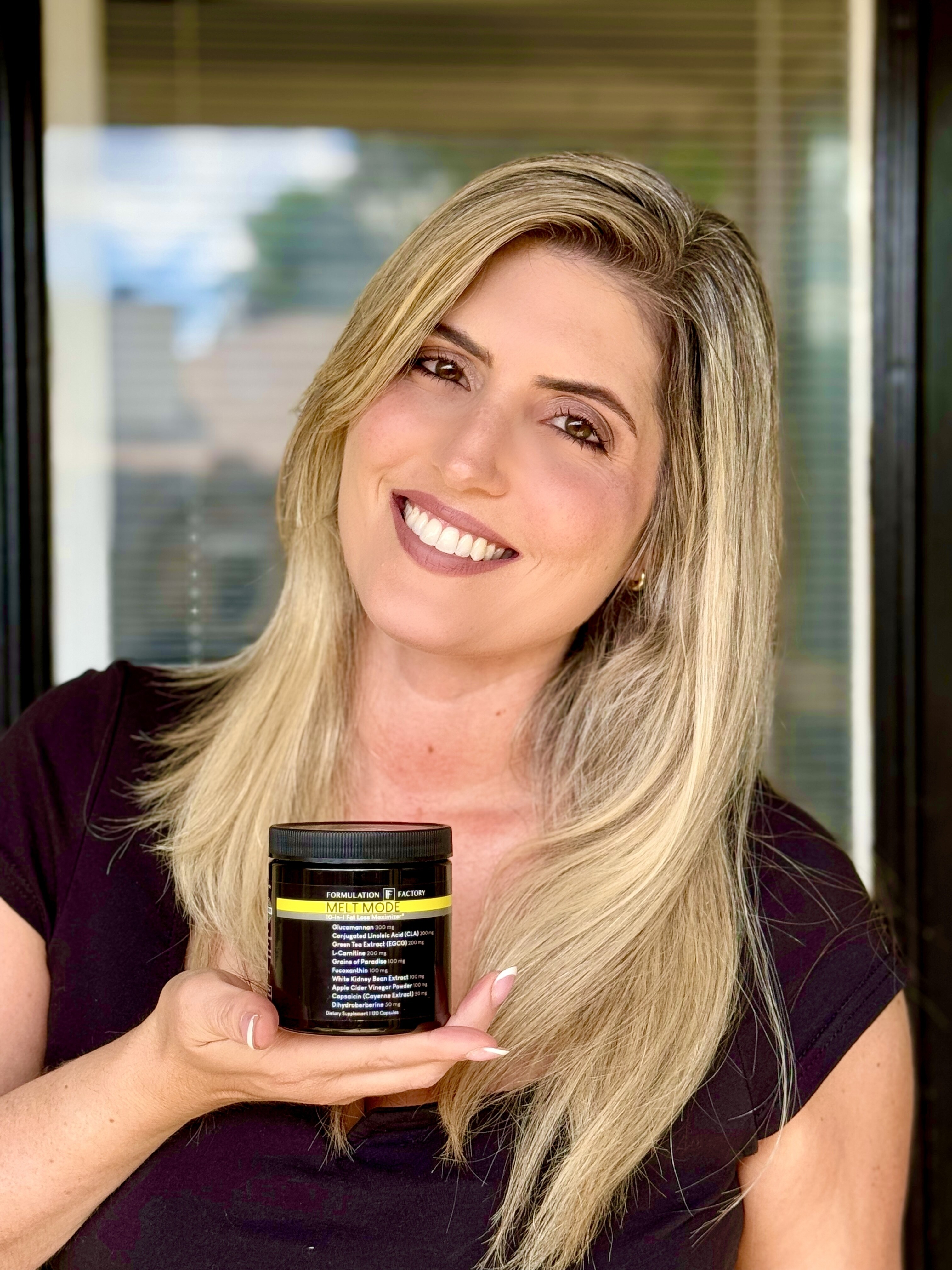 Person smiling and holding a jar labeled 'Melt Mode' in their hand.