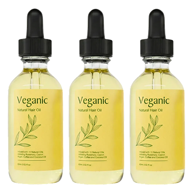 Three bottles of Veganic Natural Hair Oil with dropper caps against a black background.