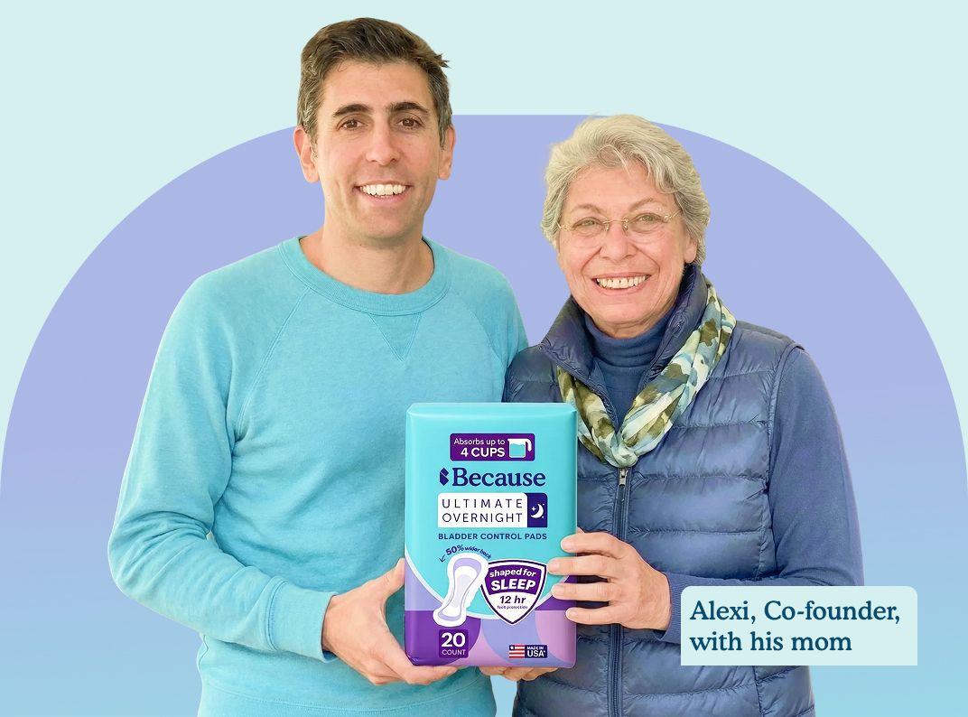 Alexi, Co-founder of Because, and his mom smile while holding a package of bladder control pads.