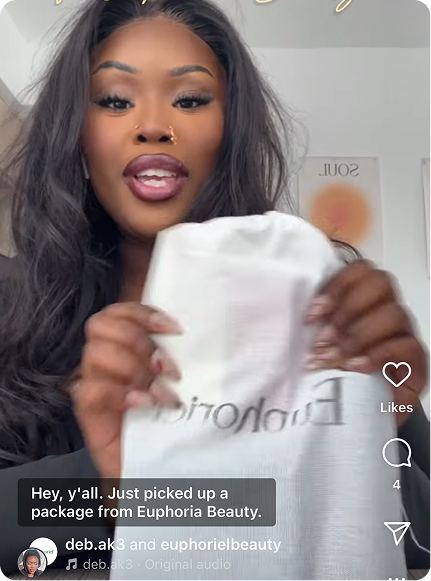 Person holding a package labeled 'Euphoria' with text overlay.