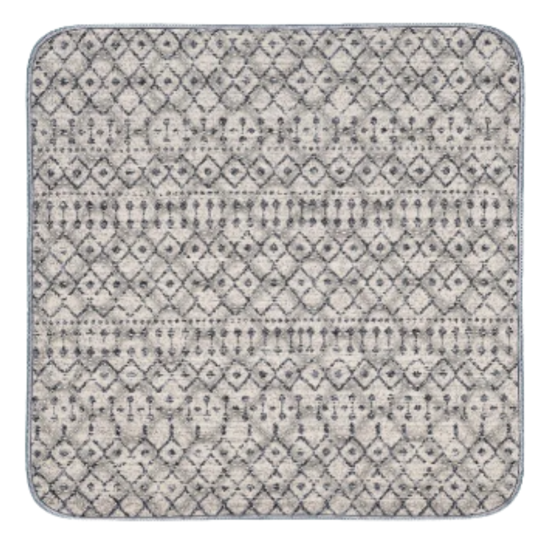 Square rug with a geometric pattern in gray and white.
