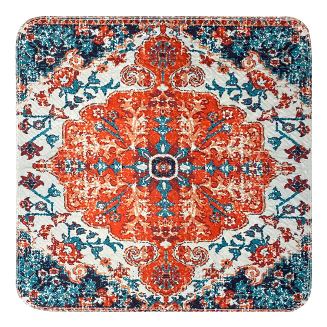 Colorful ornate rug with intricate red, blue, and white patterns.