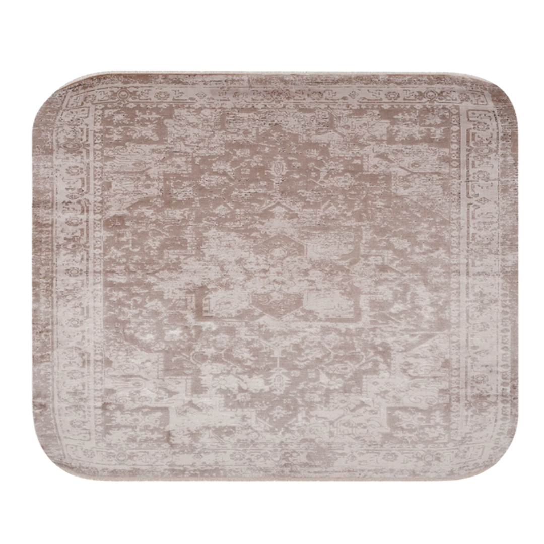 Square beige rug with intricate patterns and rounded corners.