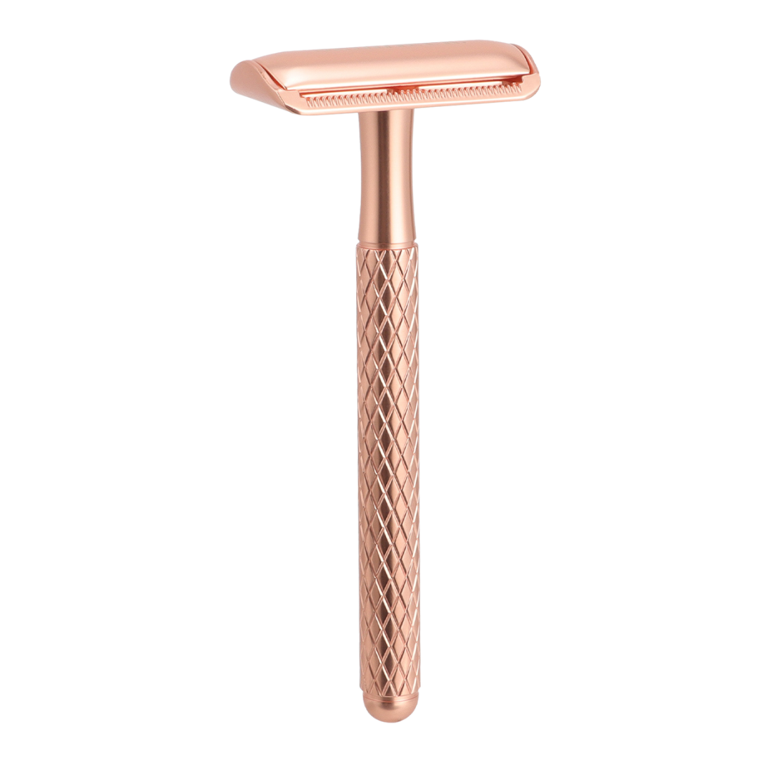 Rose gold safety razor with a textured handle on a white background.