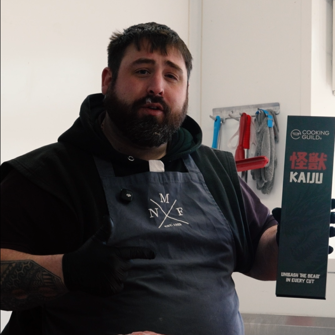 Person holding a box labeled 'Cooking Guild Kaiju' in a kitchen setting.