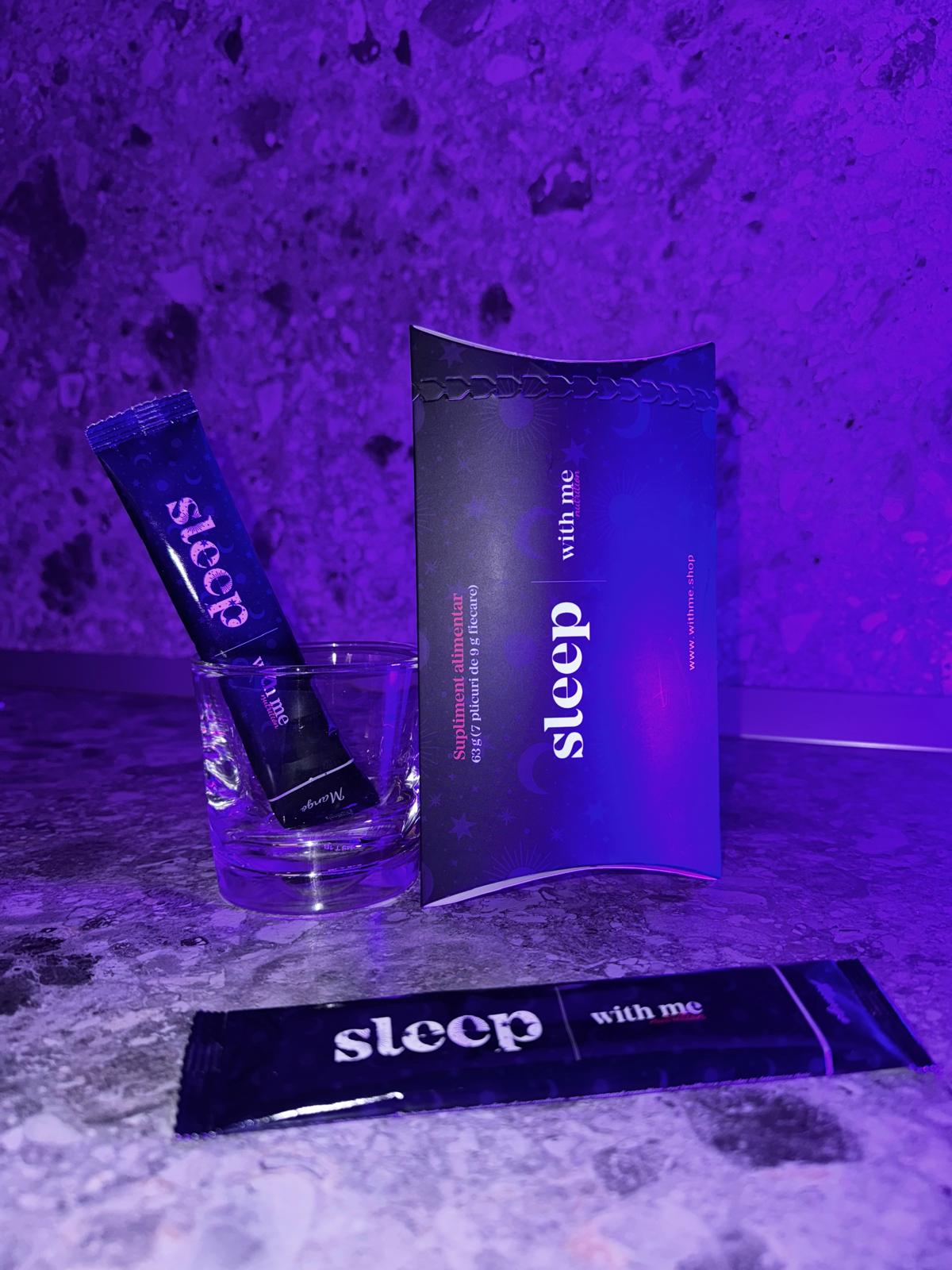 Packaged products labeled 'sleep with me' on a reflective surface with purple lighting.