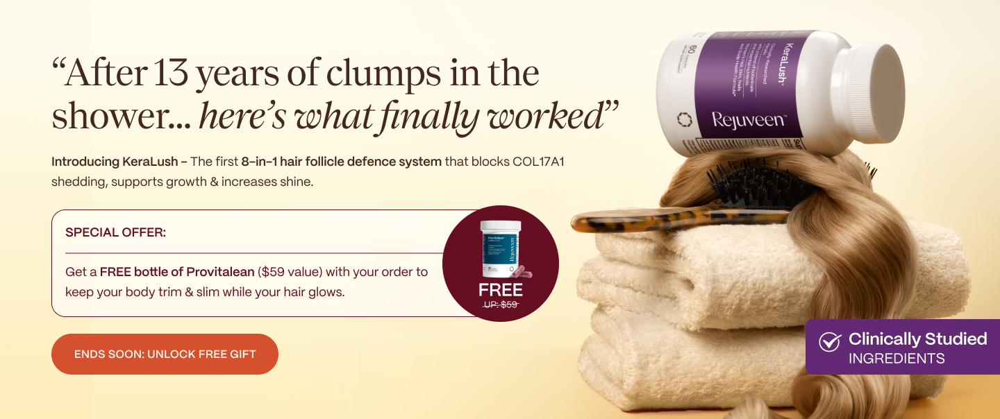 Towels and a bottle of Rejuveen with a hairbrush and hair strand.