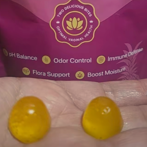 Two yellow gummies in front of purple packaging for 'Optimal Vaginal Health' supplements.