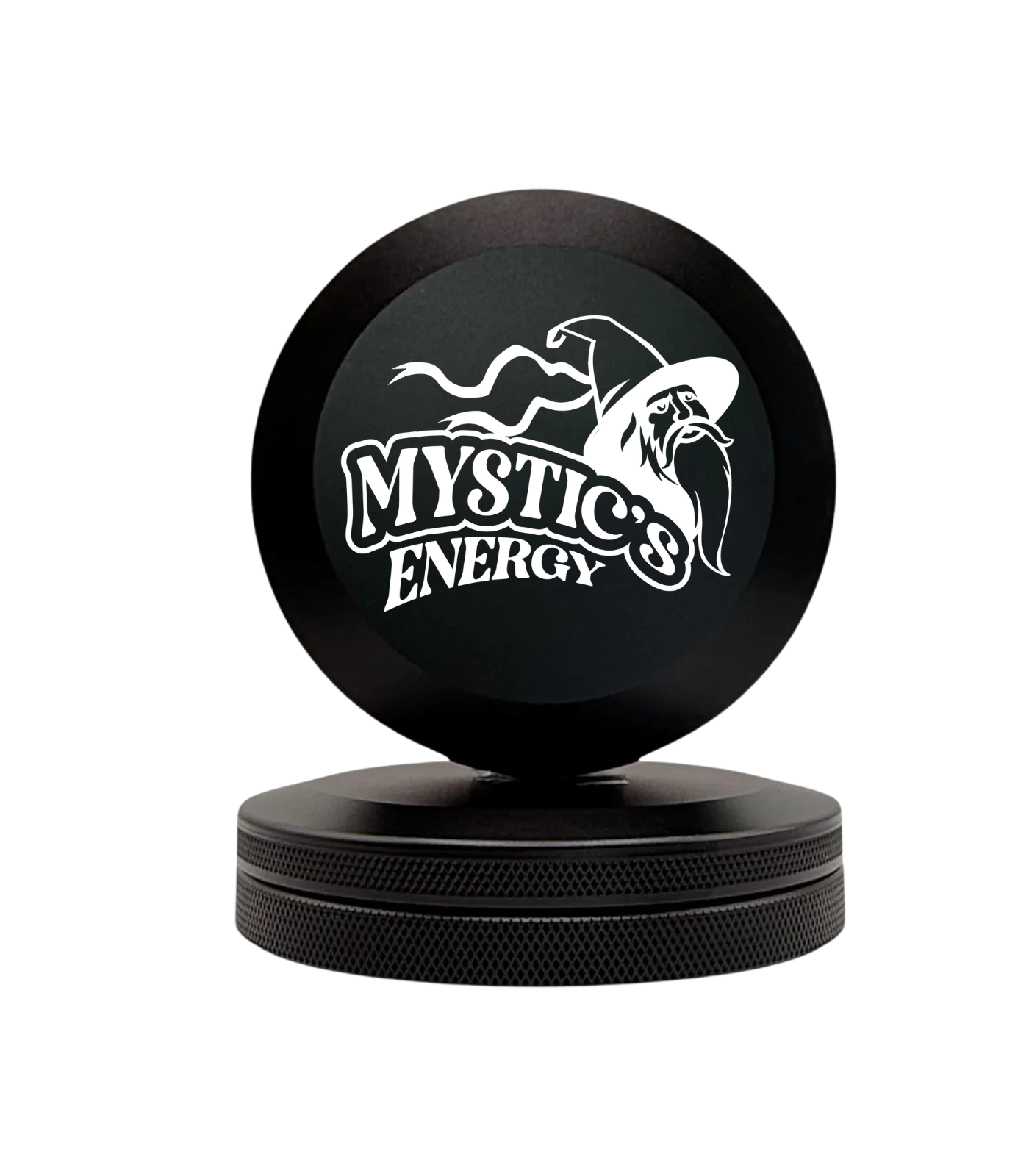 A black two-piece herb grinder with the Mystic's Energy wizard logo on the top lid.