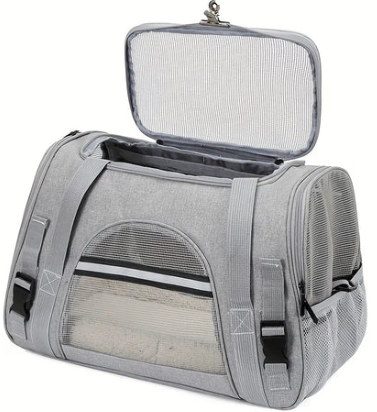 Gray pet carrier with mesh windows and an open top flap.