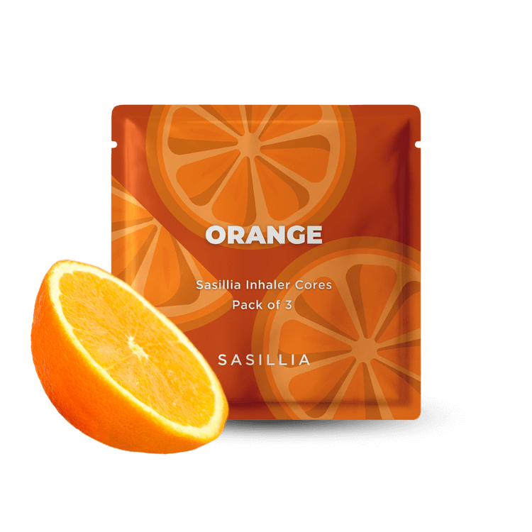 Orange-themed packaging with sliced orange design and a fresh orange in front.