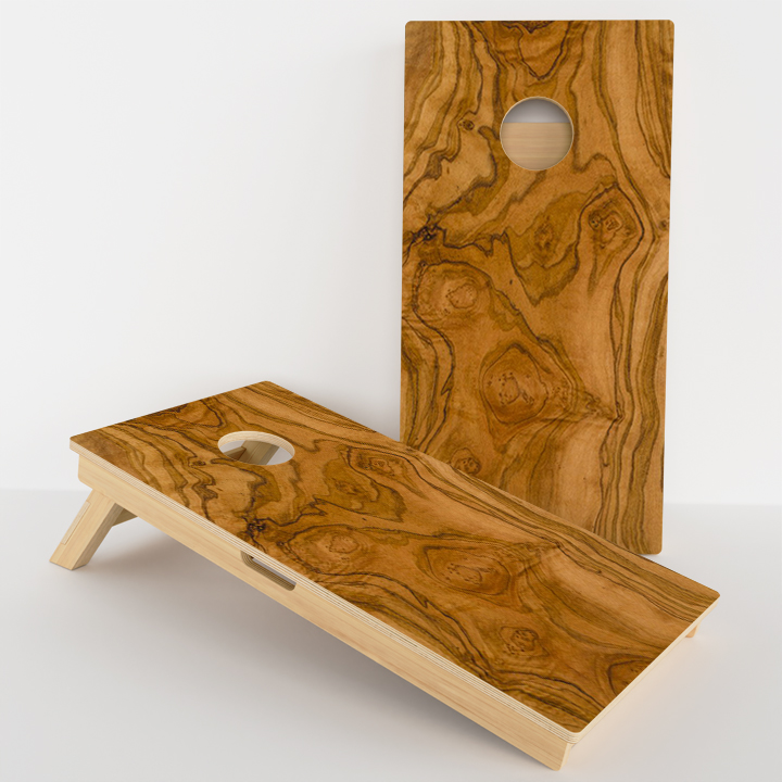 Wooden cornhole boards with a natural, decorative grain design.