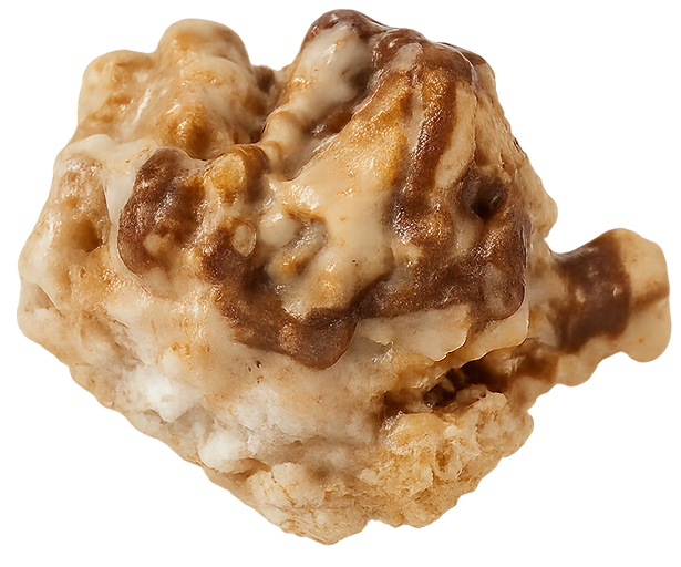 Close-up of a textured, rocky, caramel-like object with cream and brown colors.