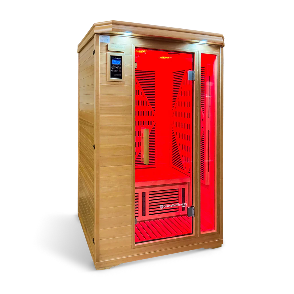 Wooden infrared sauna with red interior lights and glass door.