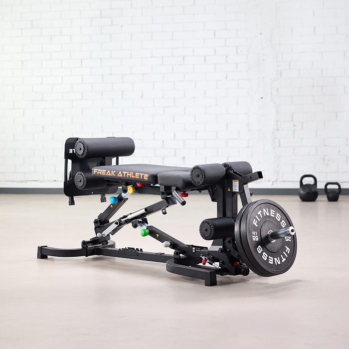 A black Freak Athlete adjustable exercise bench with a weight plate loaded on it.