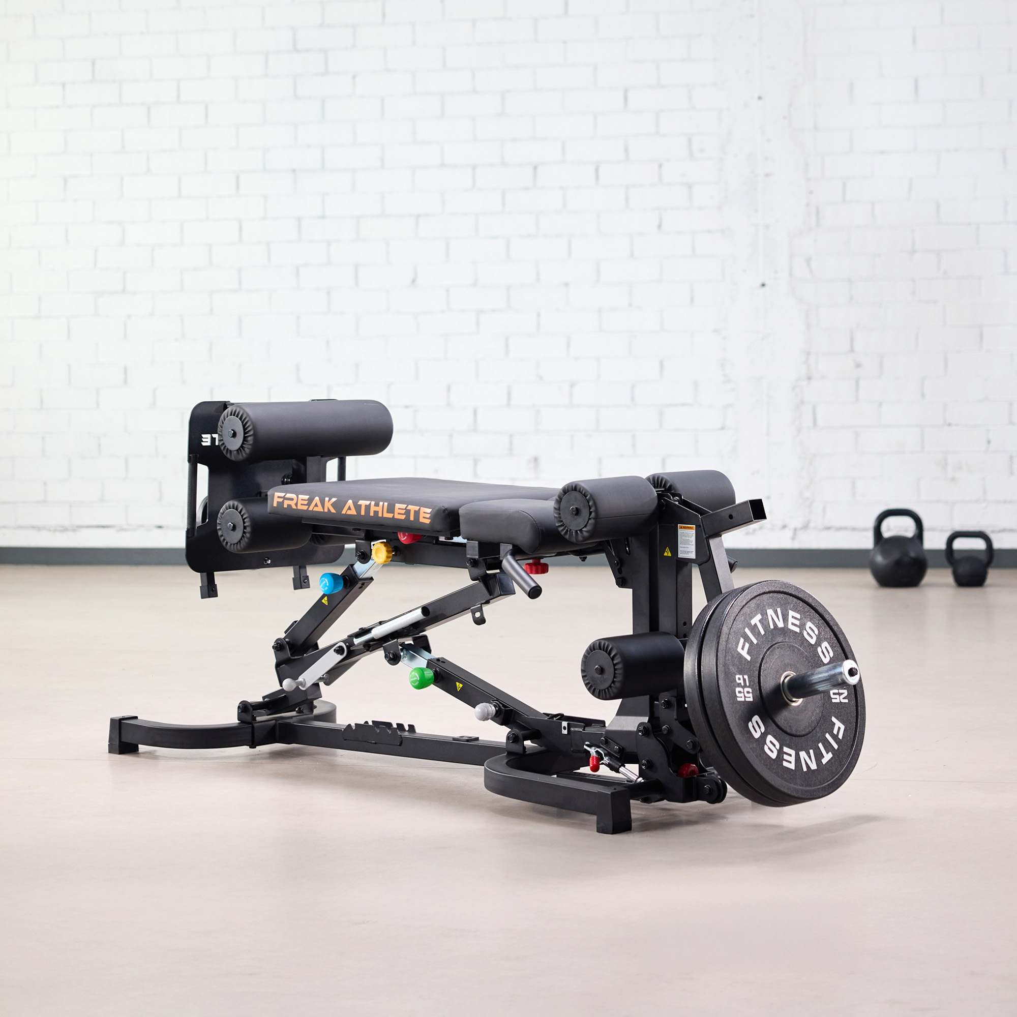 Adjustable gym bench with weights in a fitness studio.