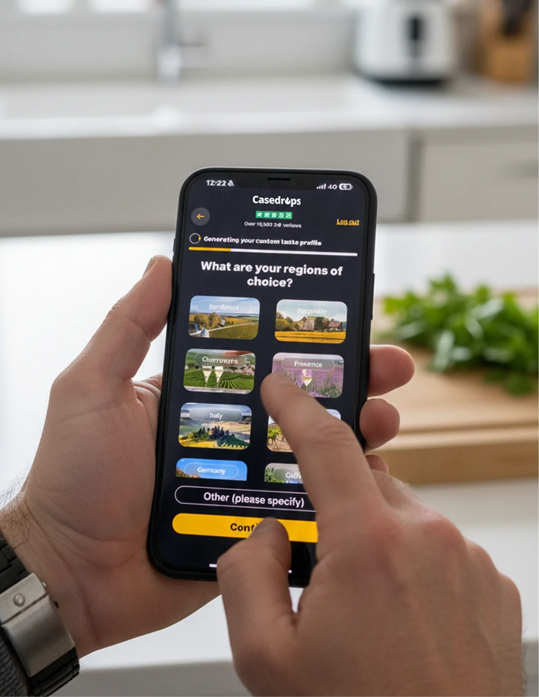 A person's hands holding a smartphone, using an app to select a region from a list.