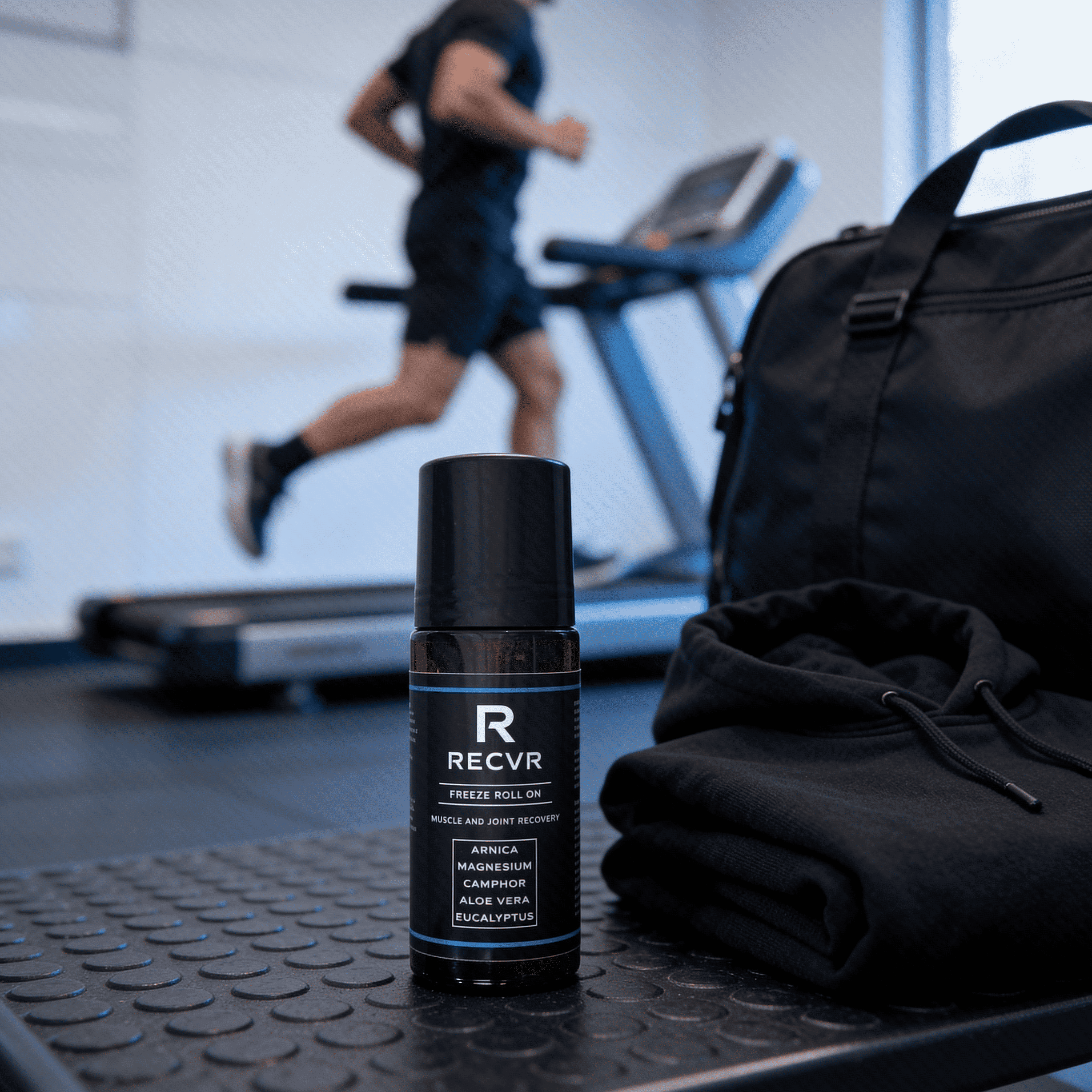 A focus on RECOVR roll-on gel with person running on treadmill in the background.