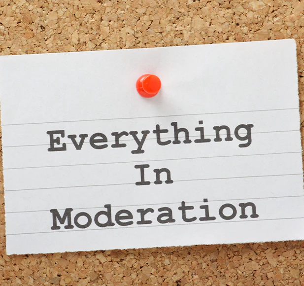 Note pinned to corkboard: 'Everything In Moderation'.
